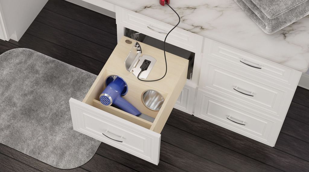 Image of bathroom vanity cabinet with open space under counter, and drawer with outlet and storage space. Links to Rev-A-Shelf website.