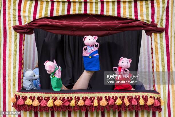 Image shows a puppet theatre with an assortment of animal puppets.