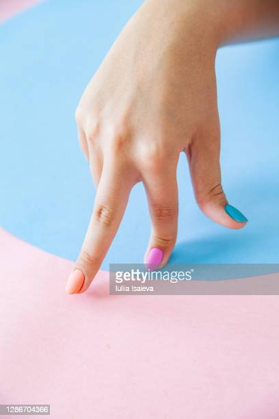 Image shows a person's hand with fingers "walking" across a surface.