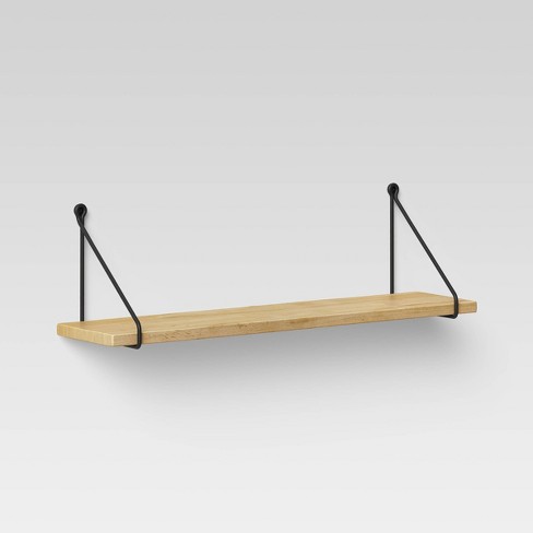Image of wooden shelf with black metal wall brackets, with link to Target website.