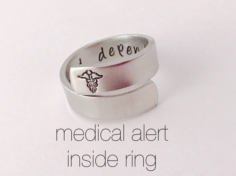 Image depicts customizable metal medical alert ring, with link to Etsy seller.