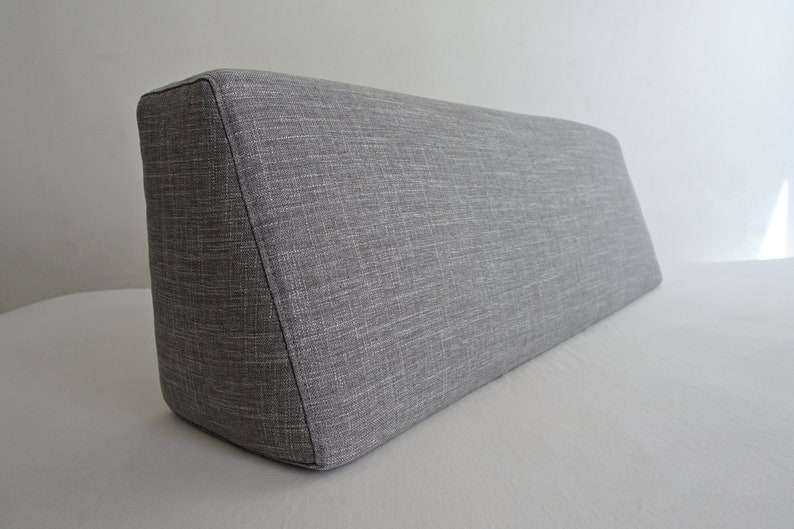 Image shows upholstered bolster pillow, and links to Etsy seller.