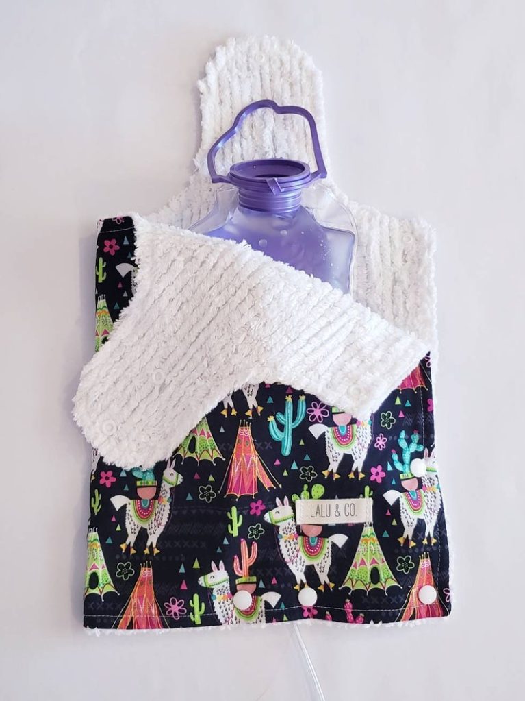 Image of lined fabric cover for gastric feeding bag with llama theme. Links to Etsy seller.