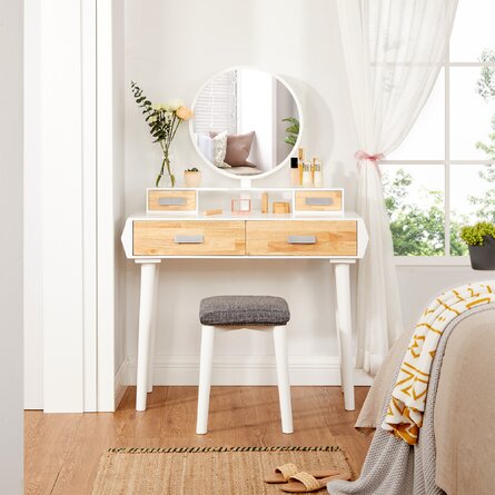 Image of small wooden vanity with drawers, attached mirror, and small stool. Links to Wayfair website.