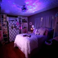 Image of child's bedroom with galaxy lights projected onto ceiling, with link to Hammacher Schlemmer site.