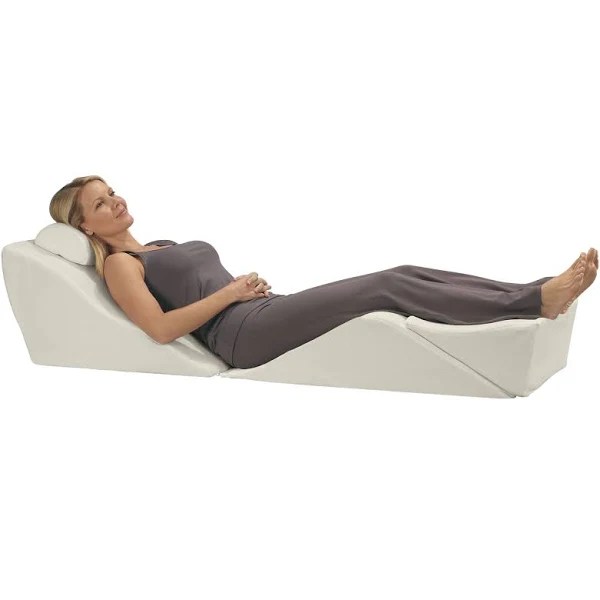 Image shows woman resting on a series of contoured and angled pillows and links to Contour Living website.
