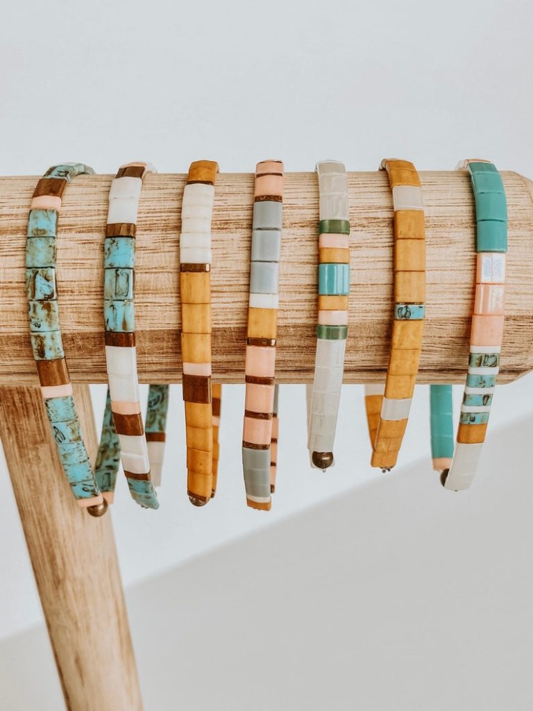 Image of seven beaded bracelets, with link to Etsy seller.