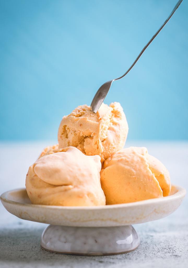 Image of orange-colored ice cream. 