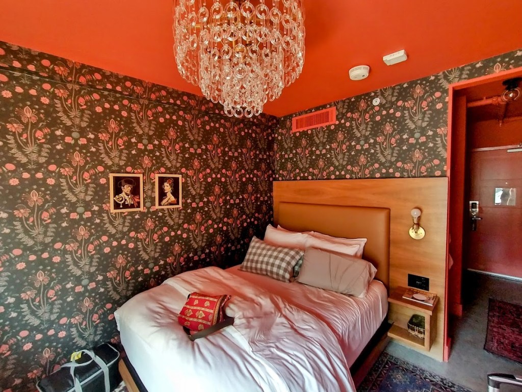 Image of a wallpapered hotel room, by Livable by Design